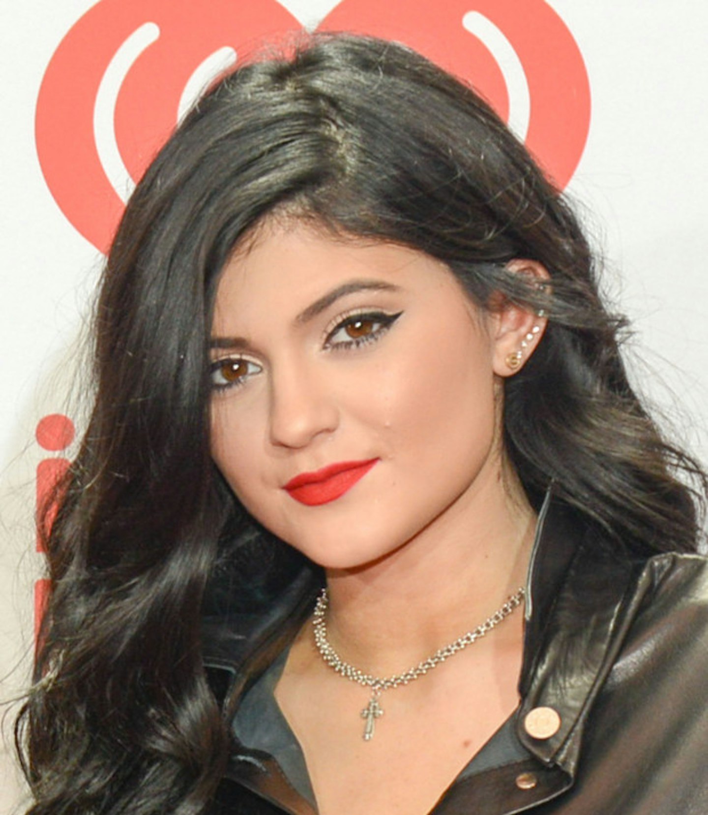 Red lipstick is a signature of Kylie's, but this one was taken a couple of years ago. What do you think, do her lips look less full back then?