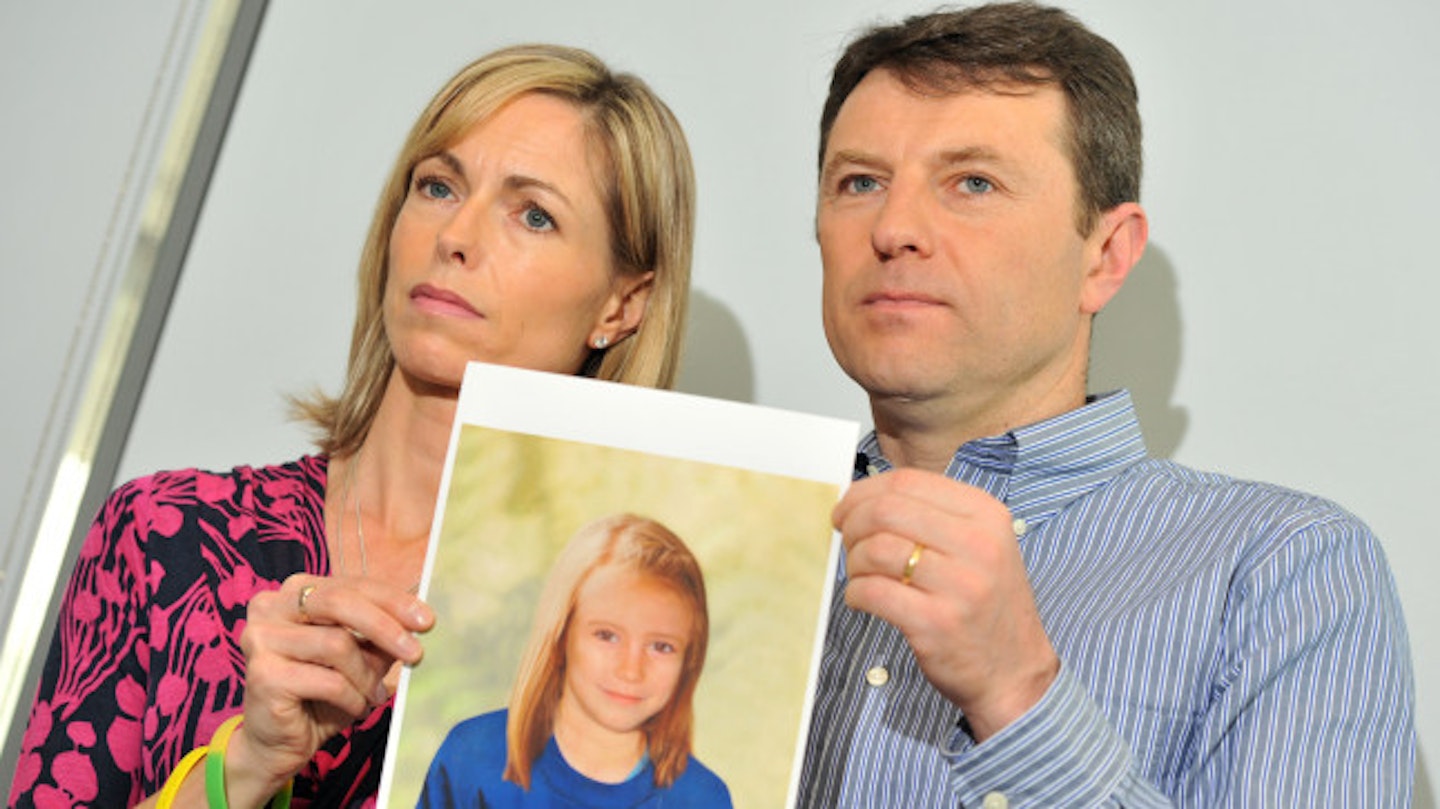Madeleine McCann's parents Kate and Gerry hold up an aged image of their daughter