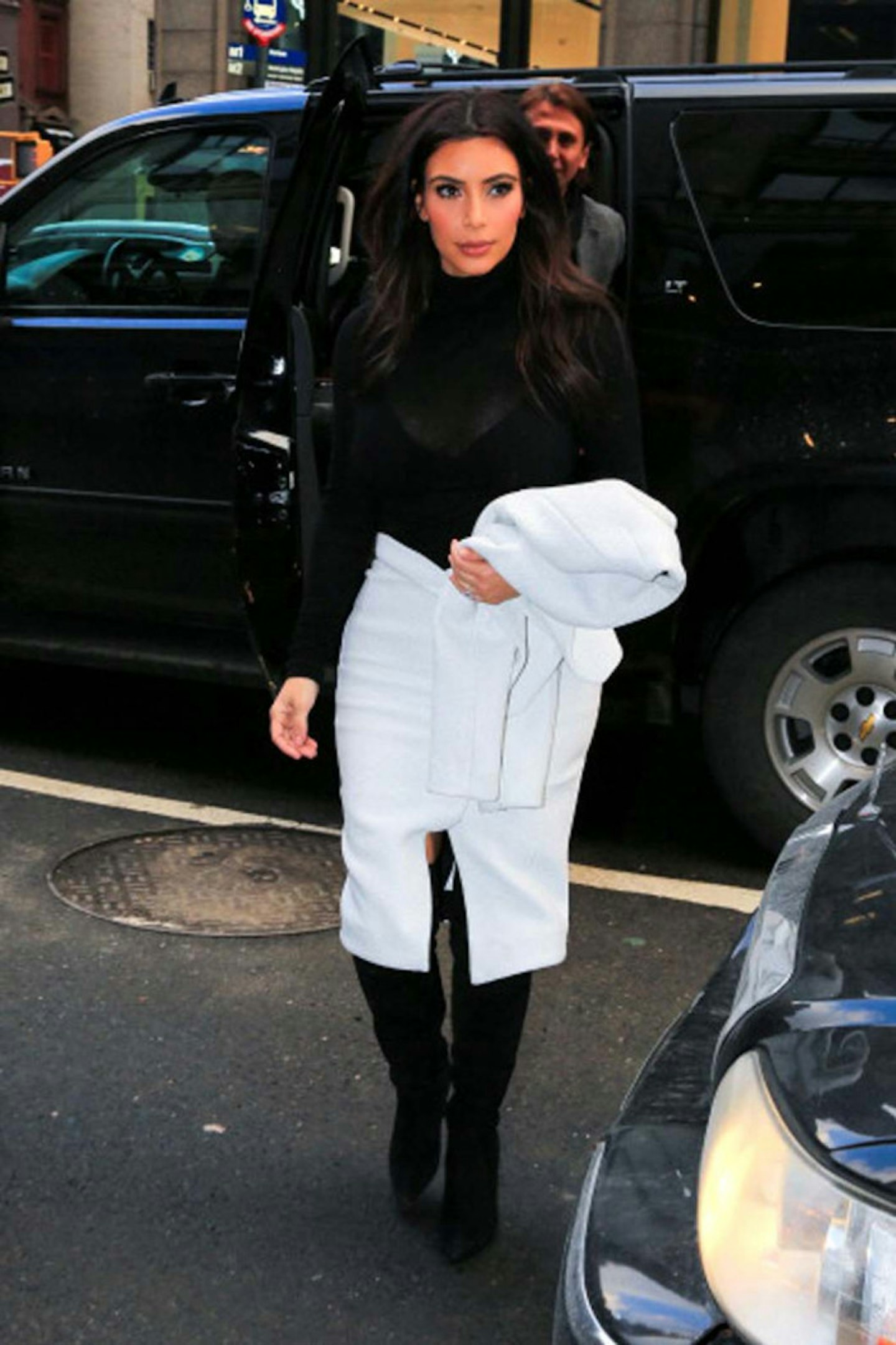 Kim Kardashian style new york black roll neck blue skirt