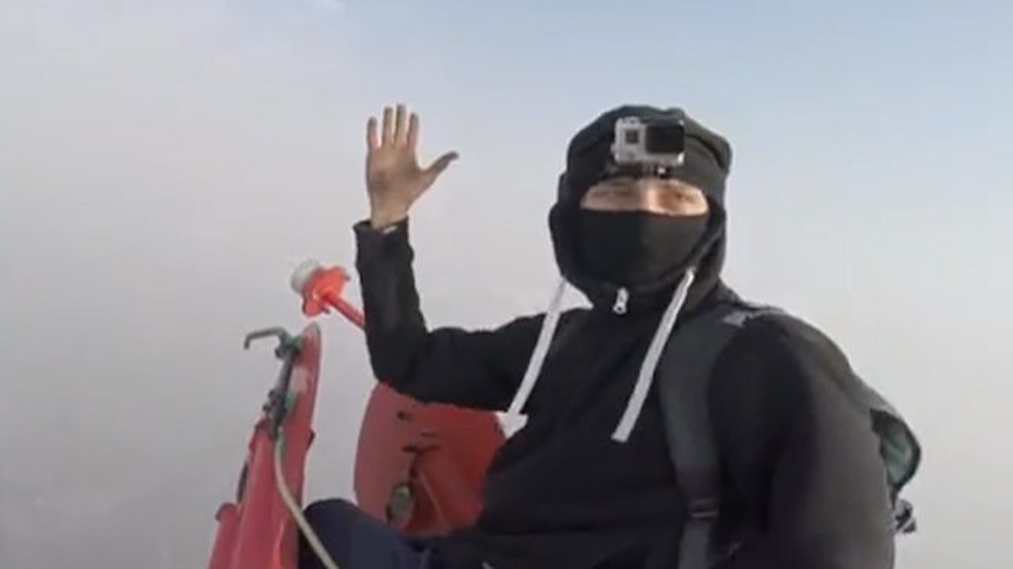 The photographers high-fived when they reached the top of the skyscraper.