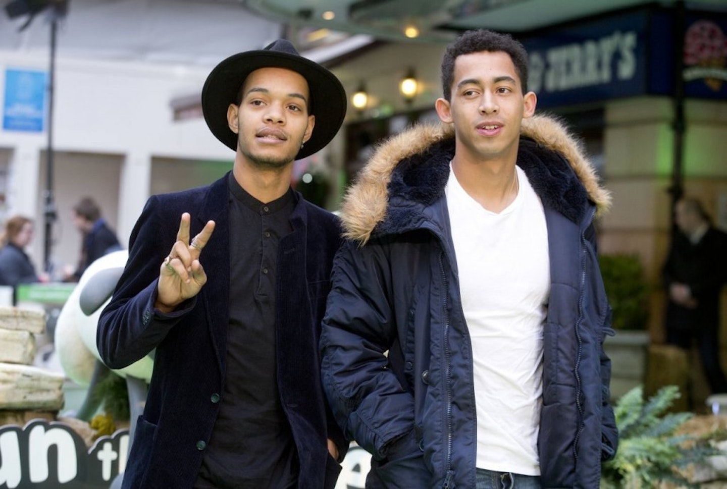 Rizzie Kicks posing for a photo in thick black jackets