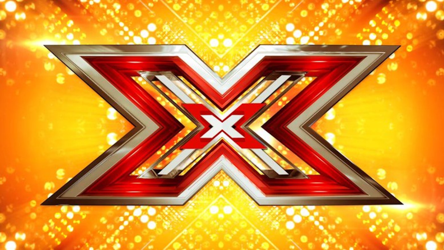 The X Factor logo on a gold background