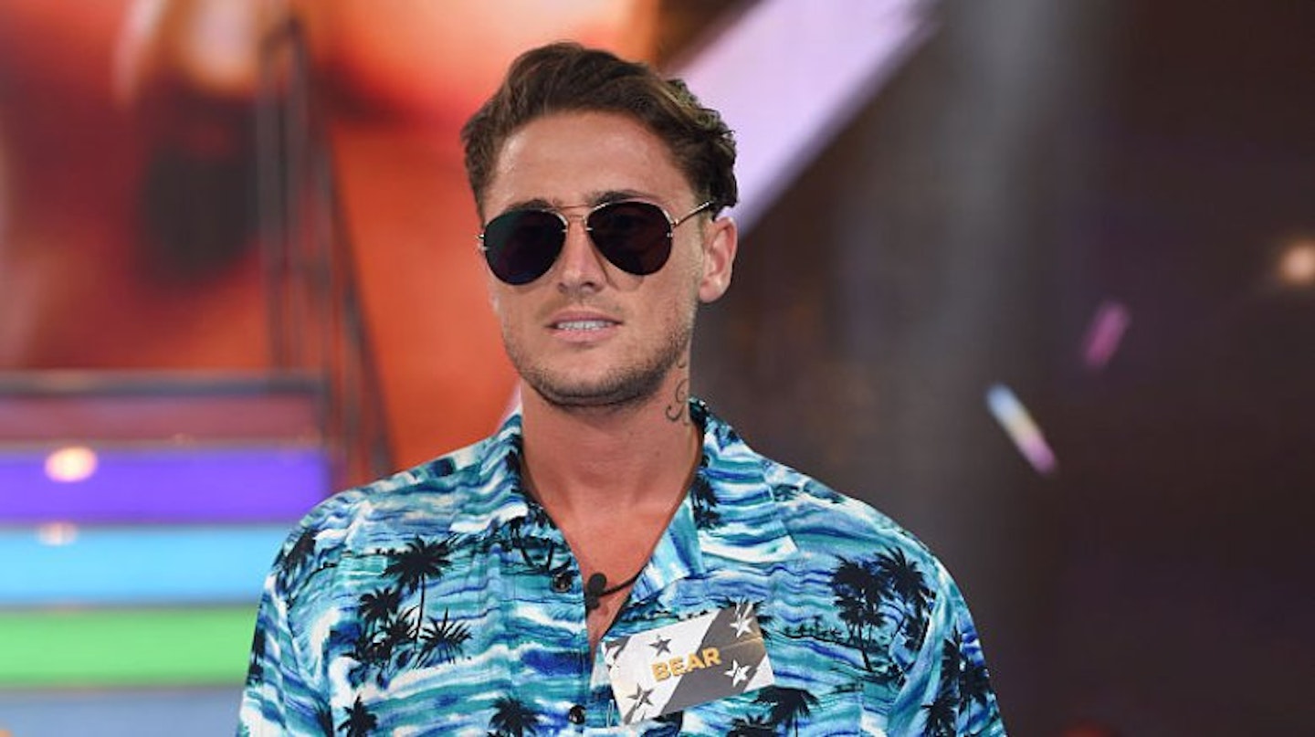 Bear wearing a hawaiian shirt and sunglasses