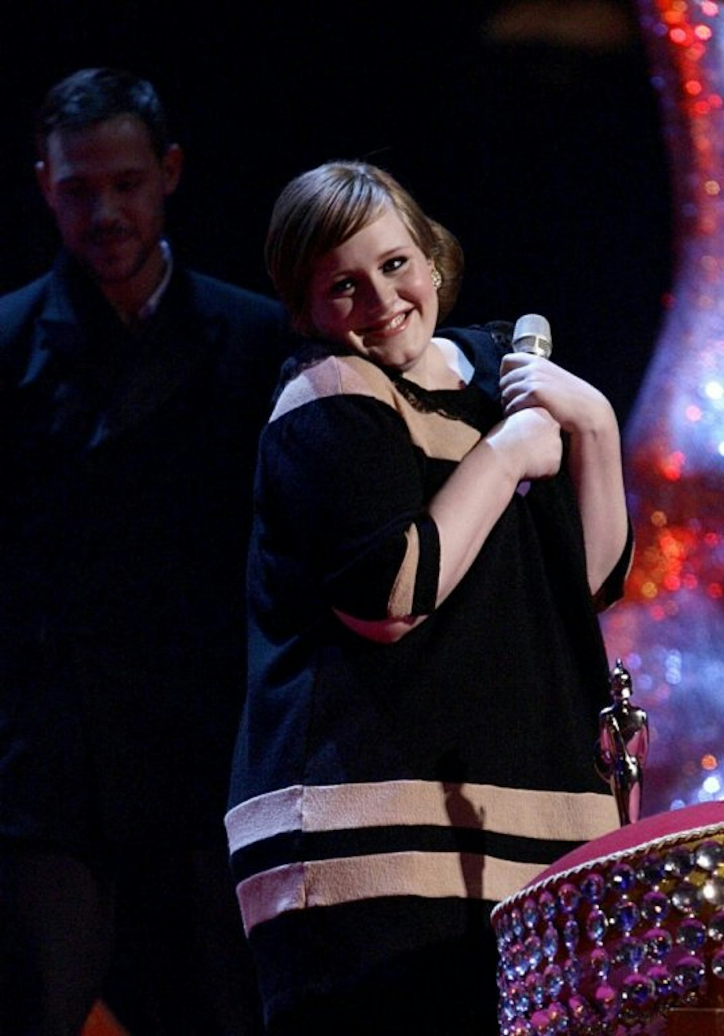 Adele holding BRIT Award