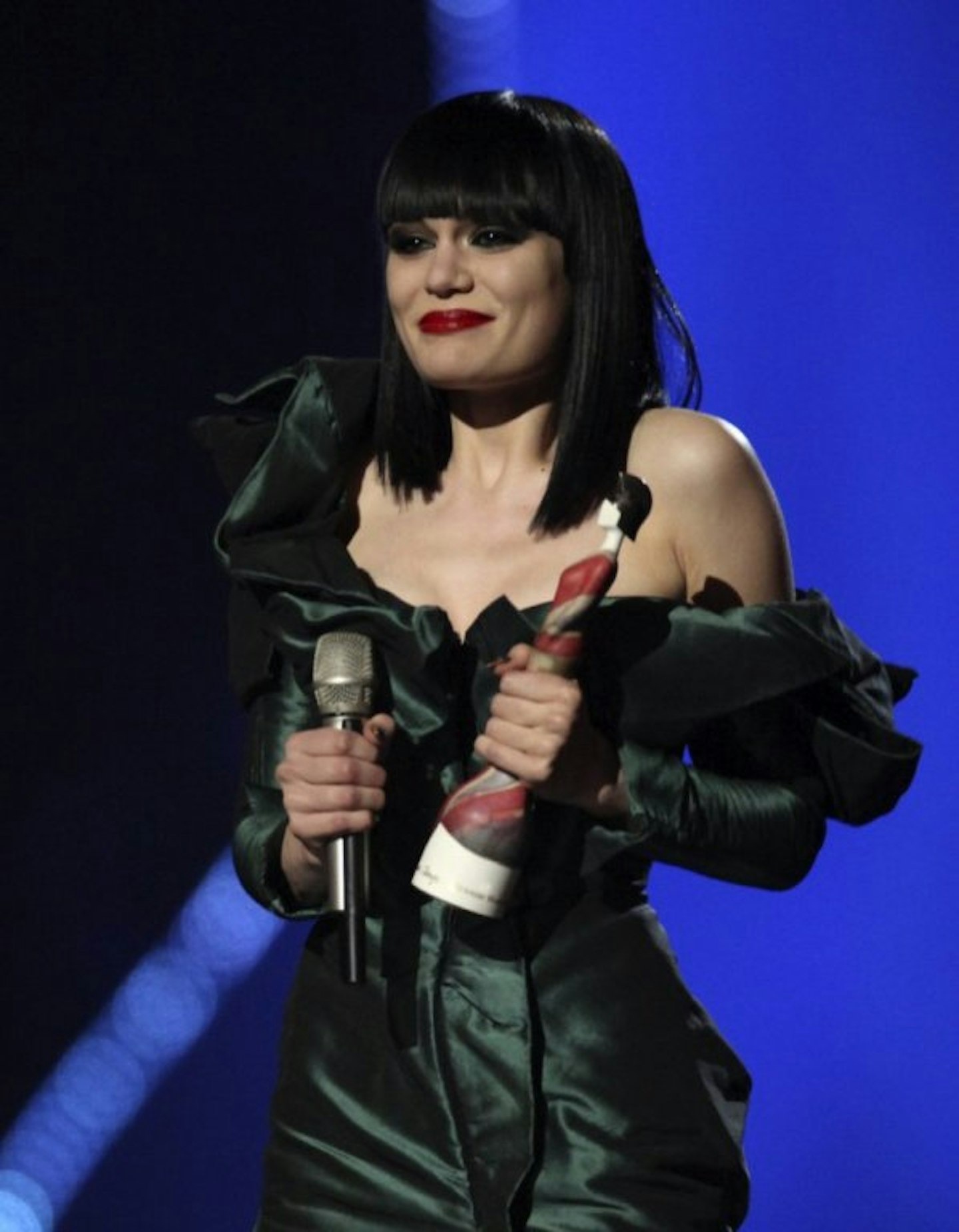 Jessie J holding a BRIT Award