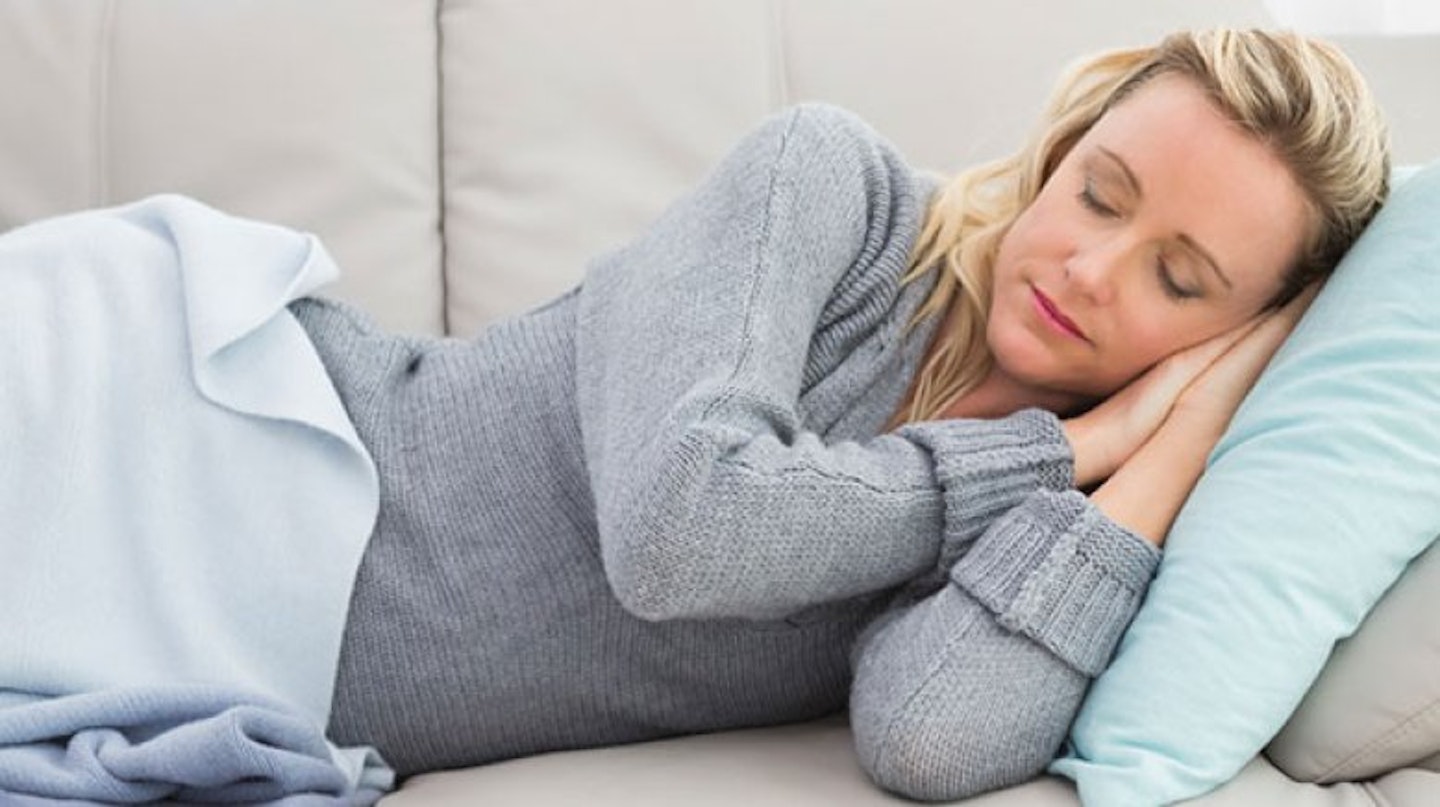 woman asleep on sofa