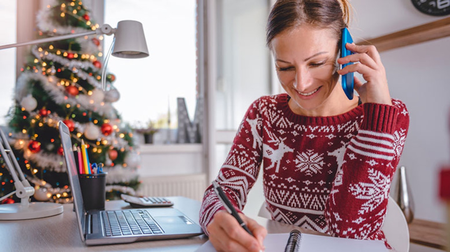Woman working from home at Christmas