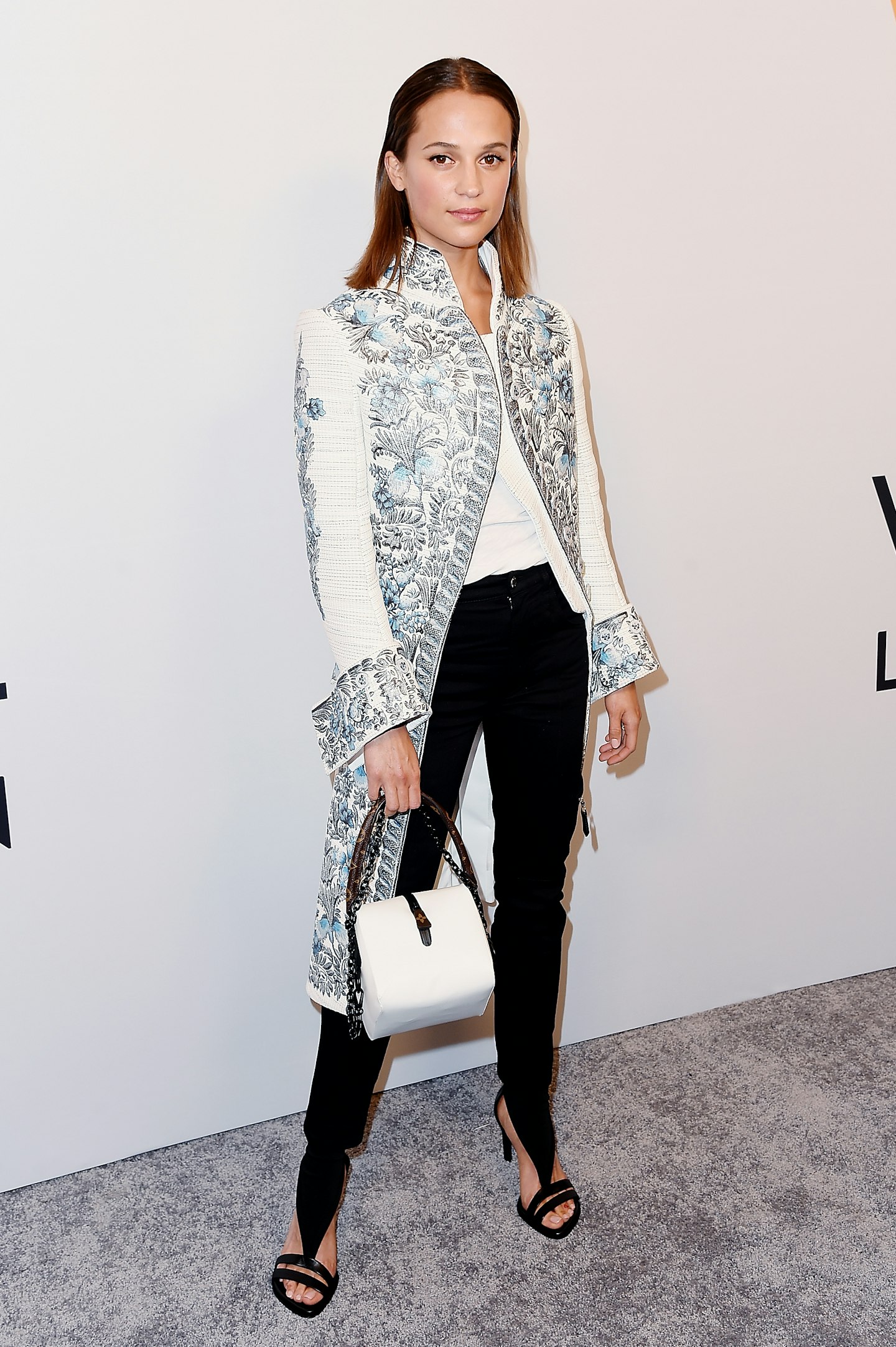 Alicia Vikander, Michael Fassbender Shine in Silver at Paris Fashion Week