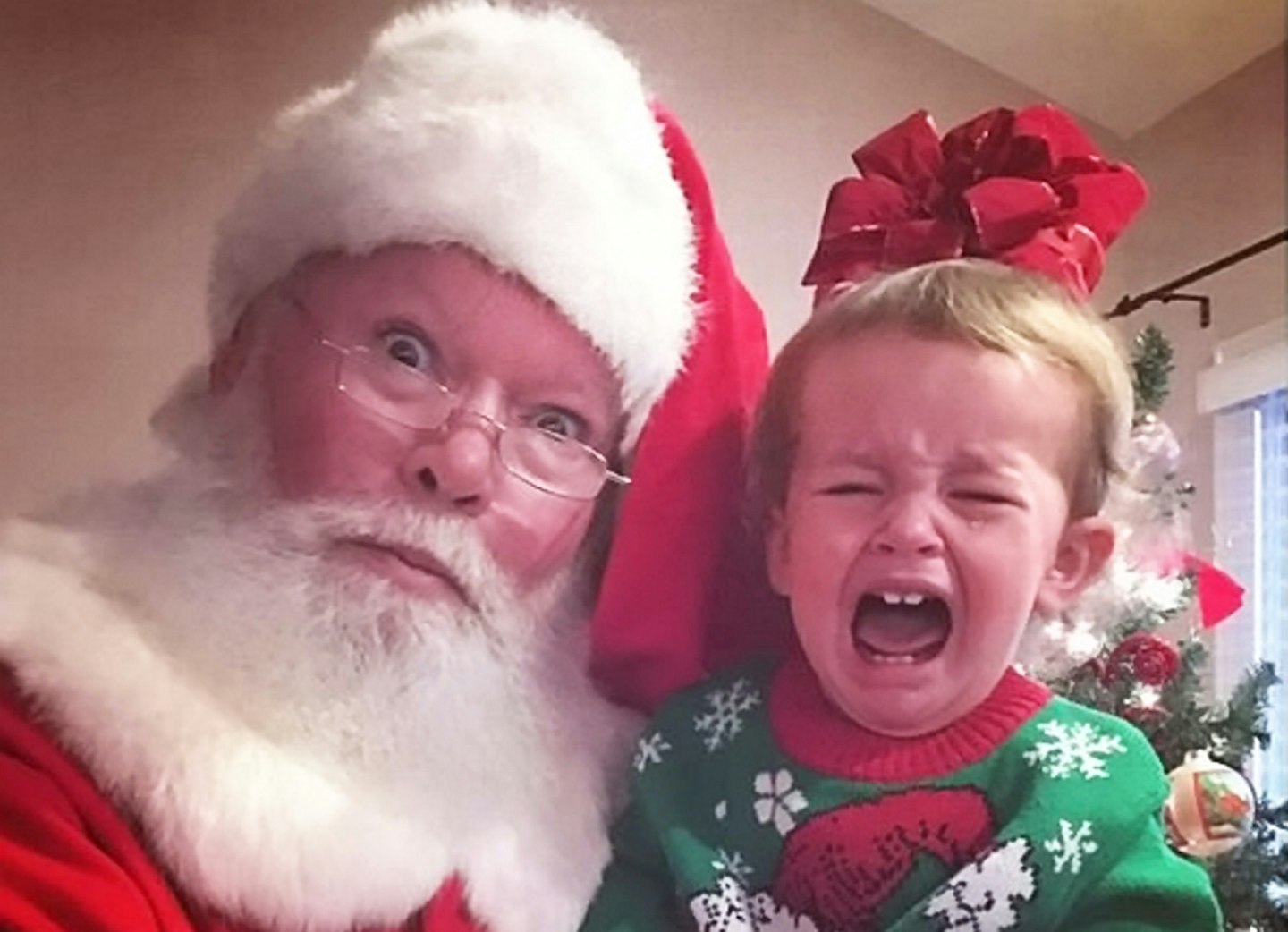 child crying santa's knee