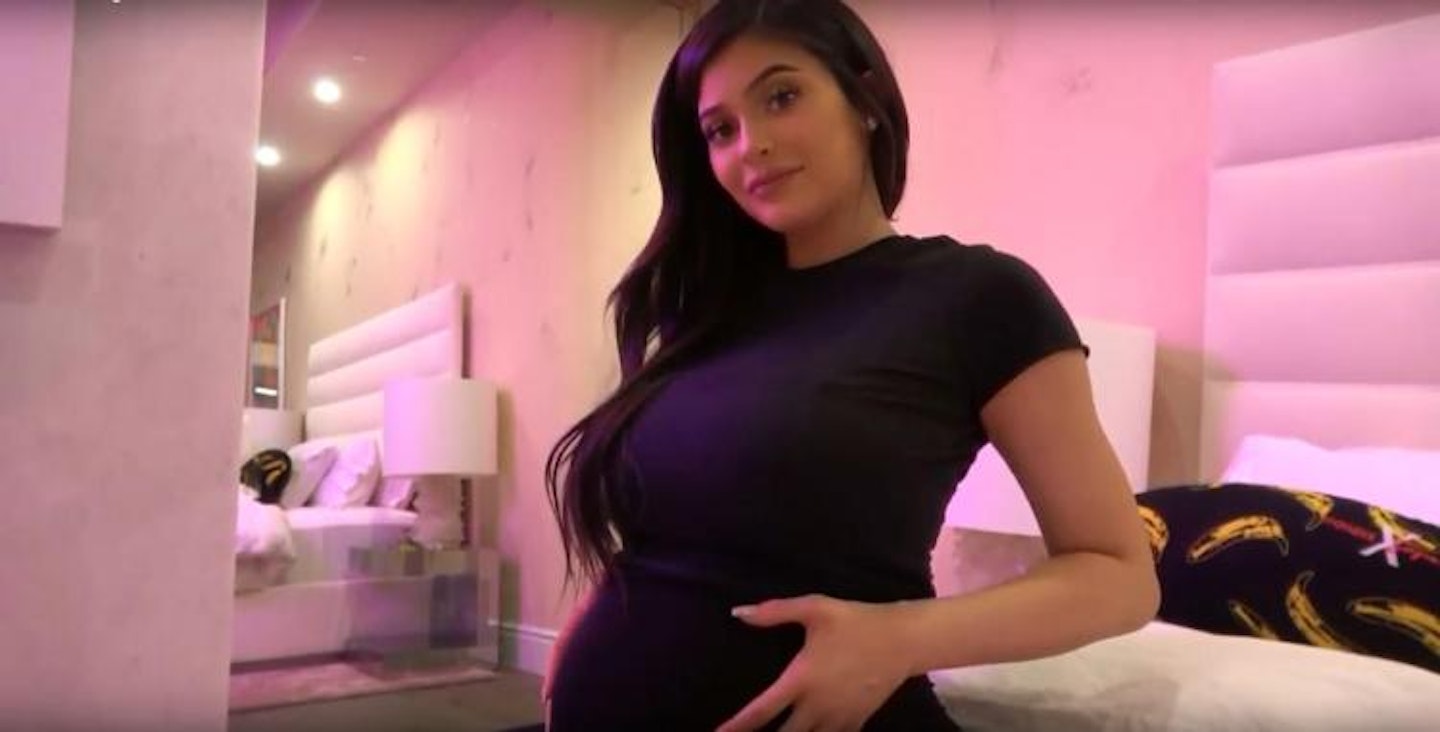 Kylie Jenner holds her baby bump