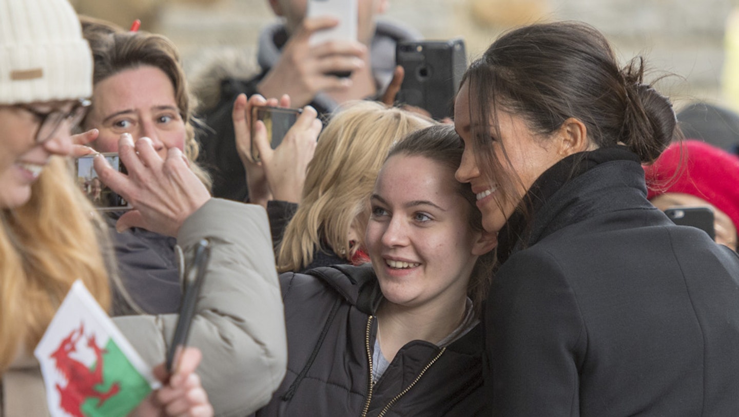 Meghan Markle posing for a photo