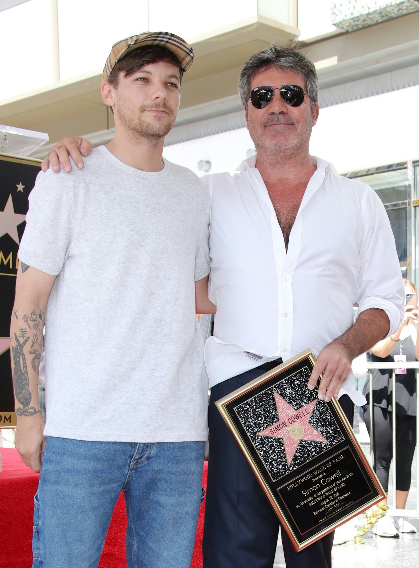Louis Tomlinson and Simon Cowell