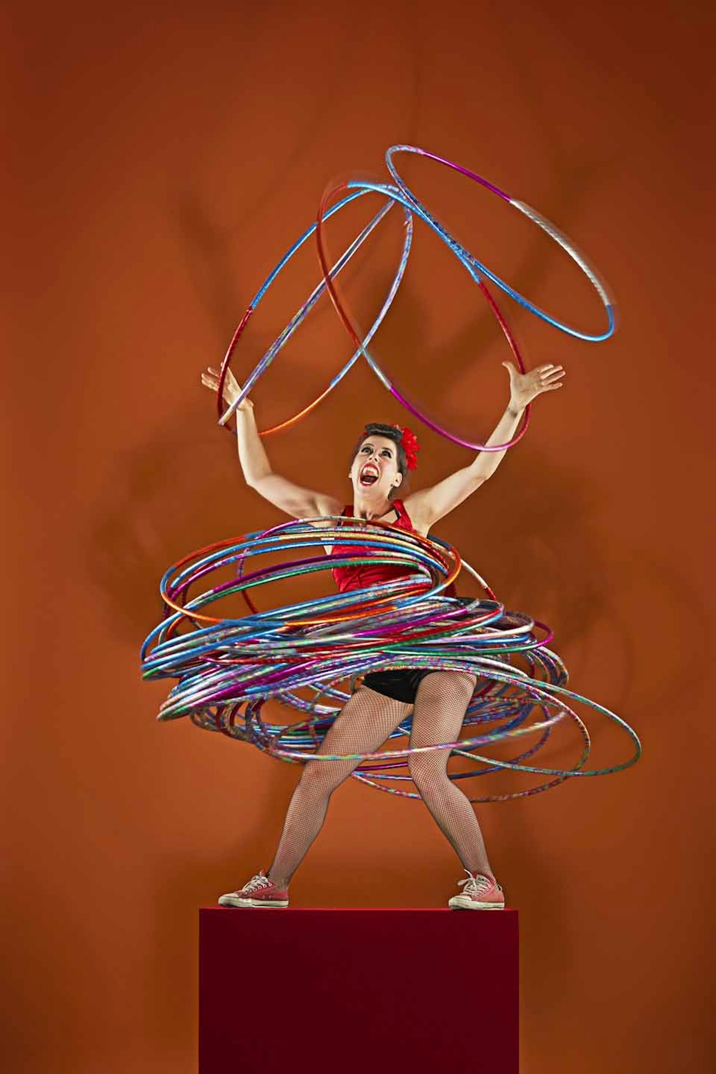 Most hula-hoops spun simultaneously on multi-body parts