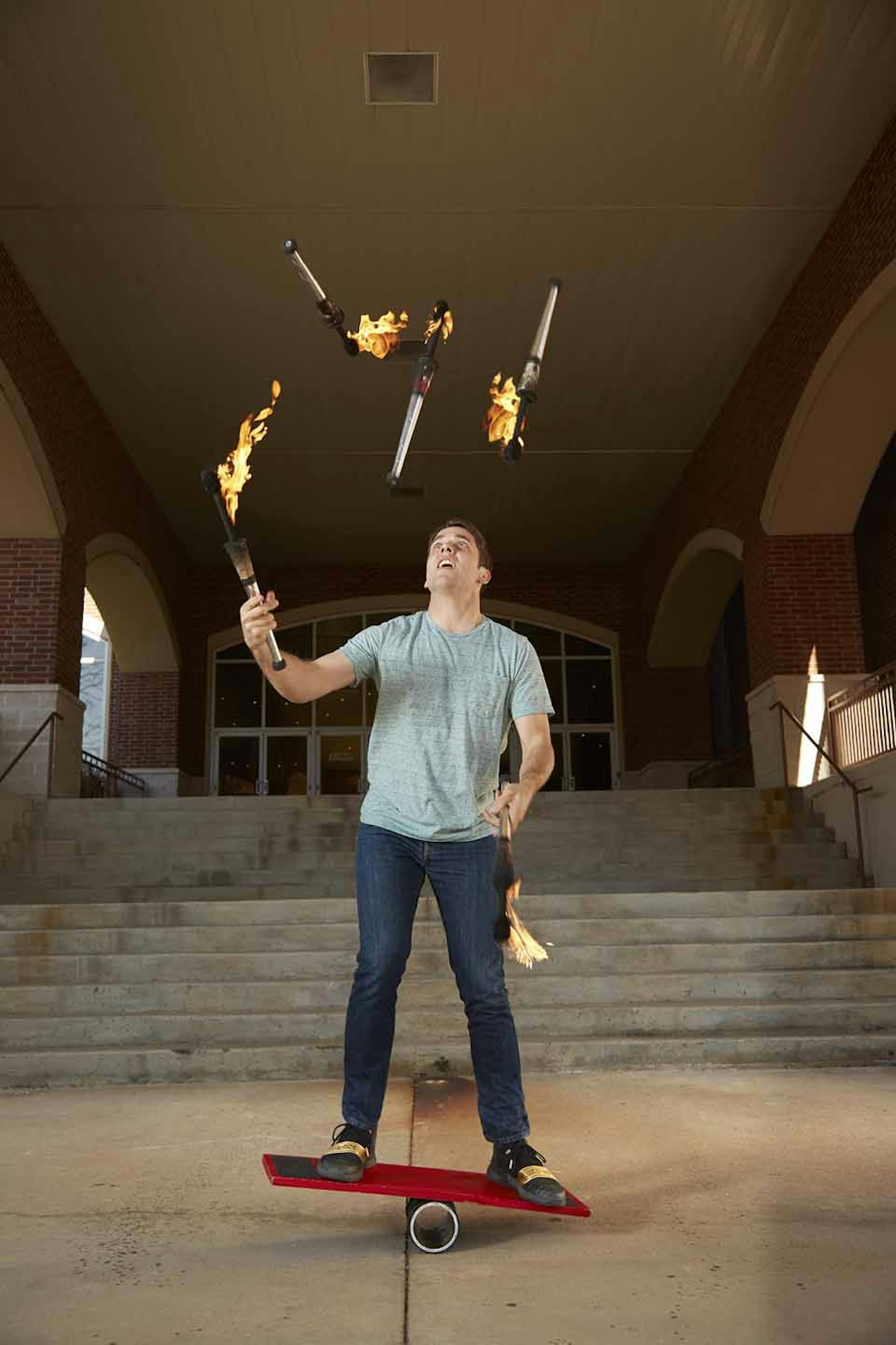 Most torches juggled on a balance board