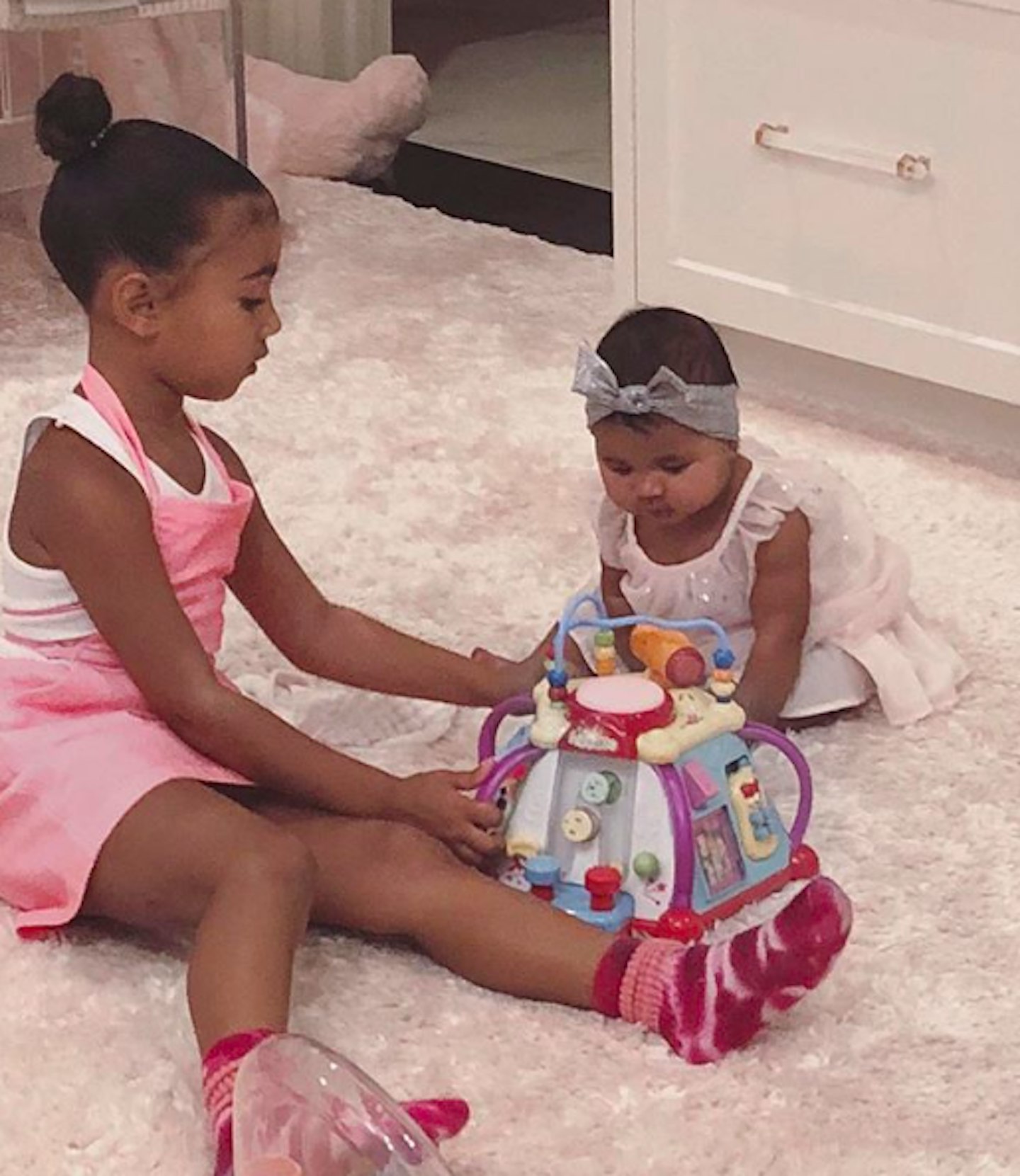 North West and True Thompson playing