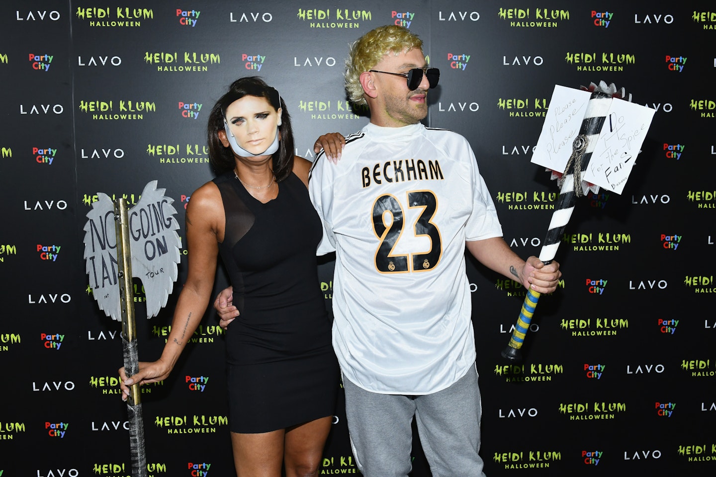Mel B dressed as Victoria Beckham and Gary Madatyan dressed as David Beckham and Heidi Klum's Halloween party