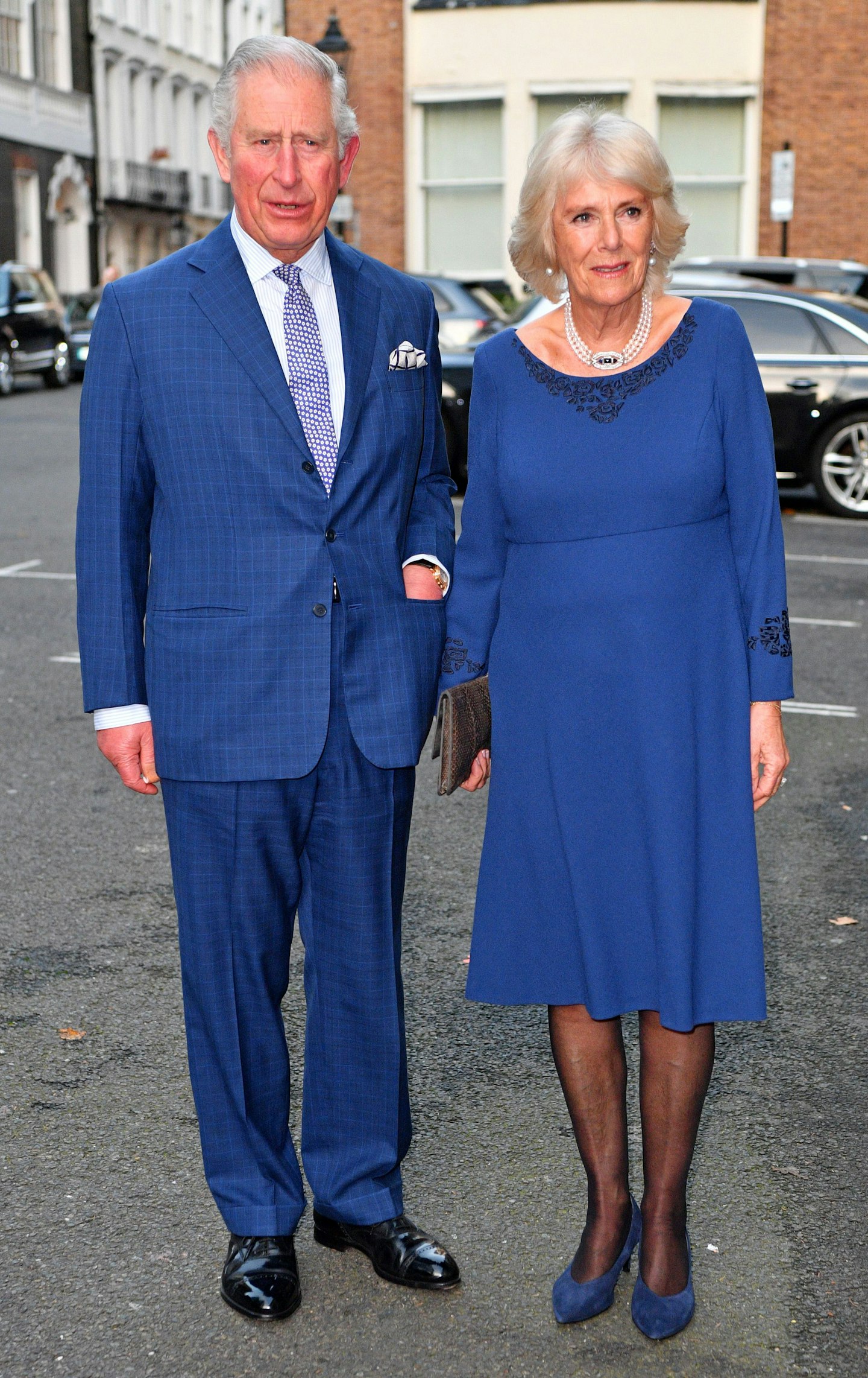 Prince of Wales coordinates in blue with wife Duchess Camilla