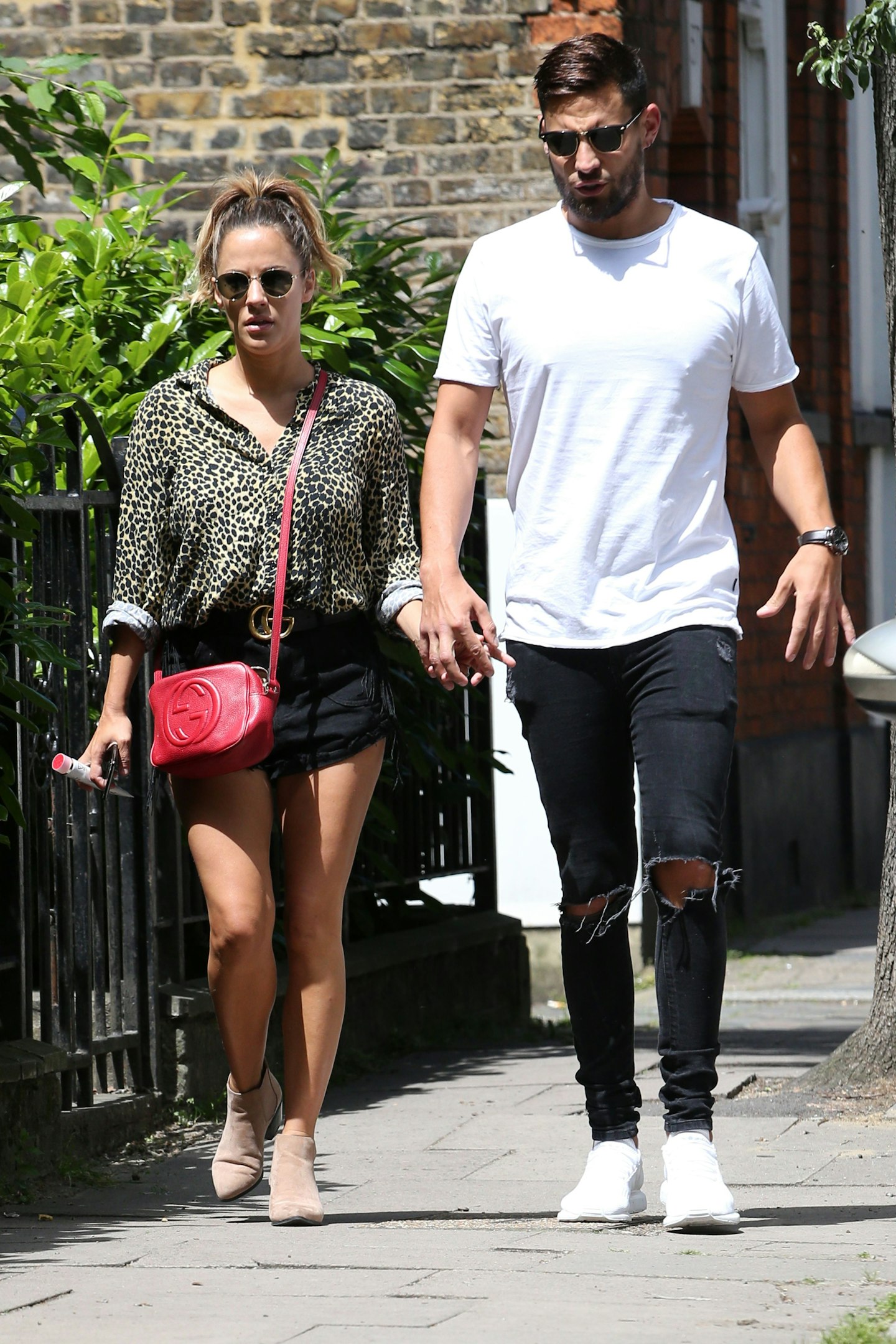 Caroline Flack and Andrew Brady out walking in June