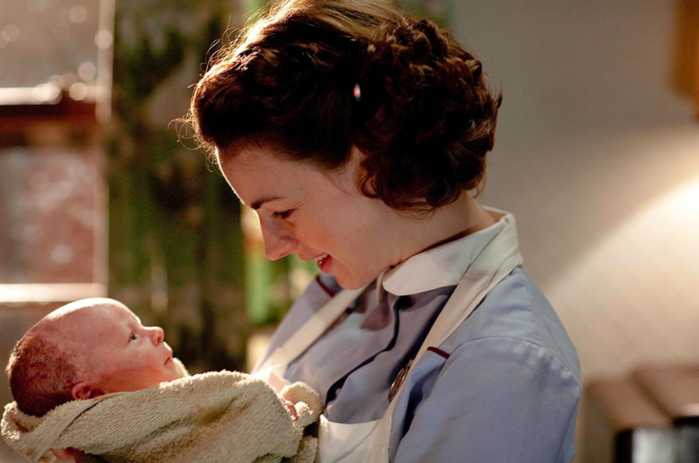 Jessica Raine in Call the Midwife holding newborn baby