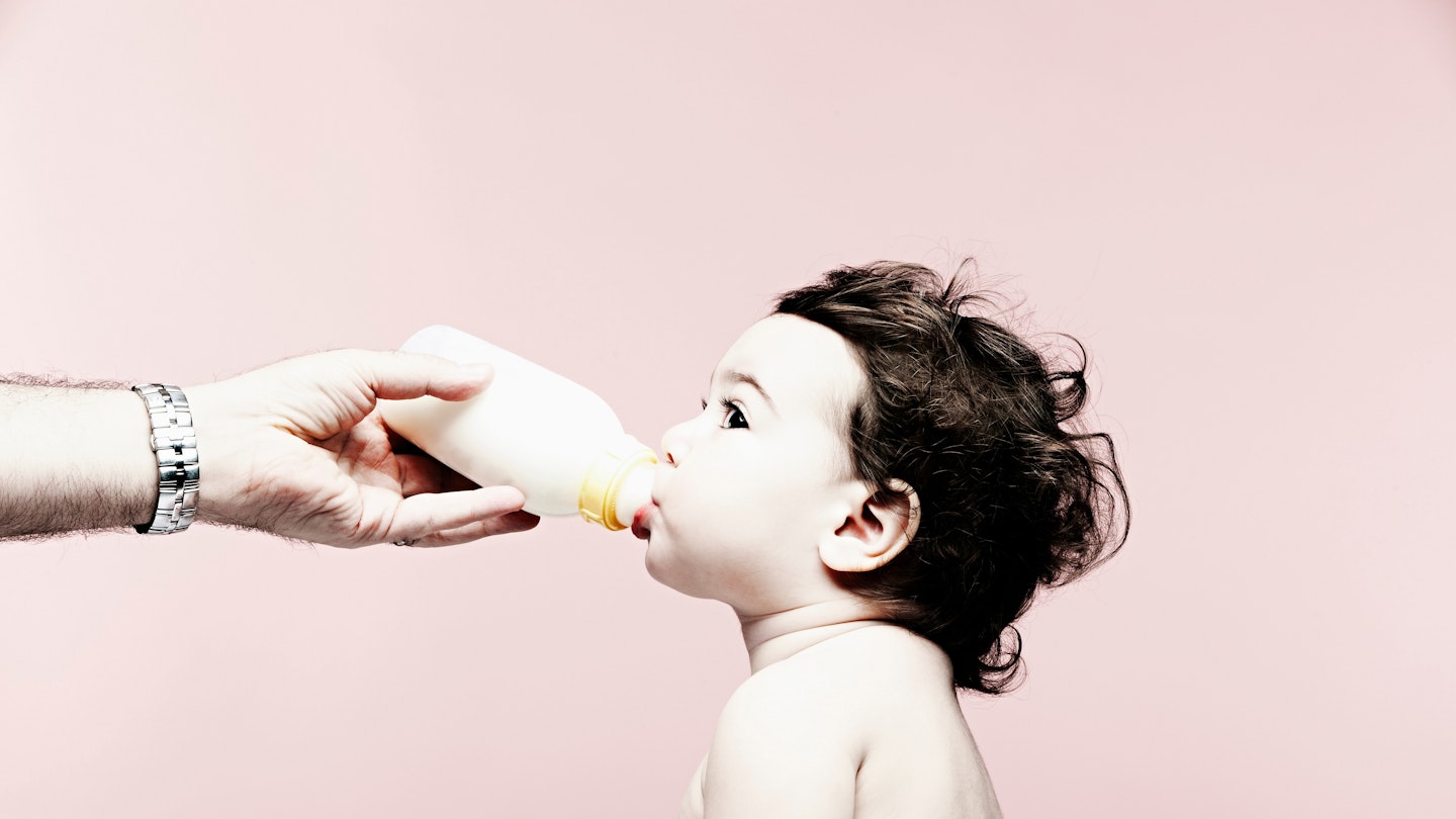 A child drinking formula milks