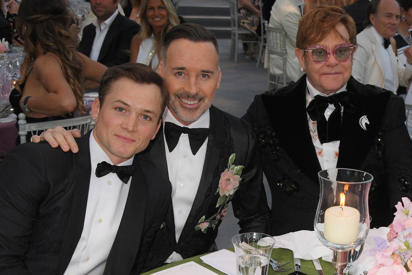 Taron Egerton with Elton John and his husband David Furnish