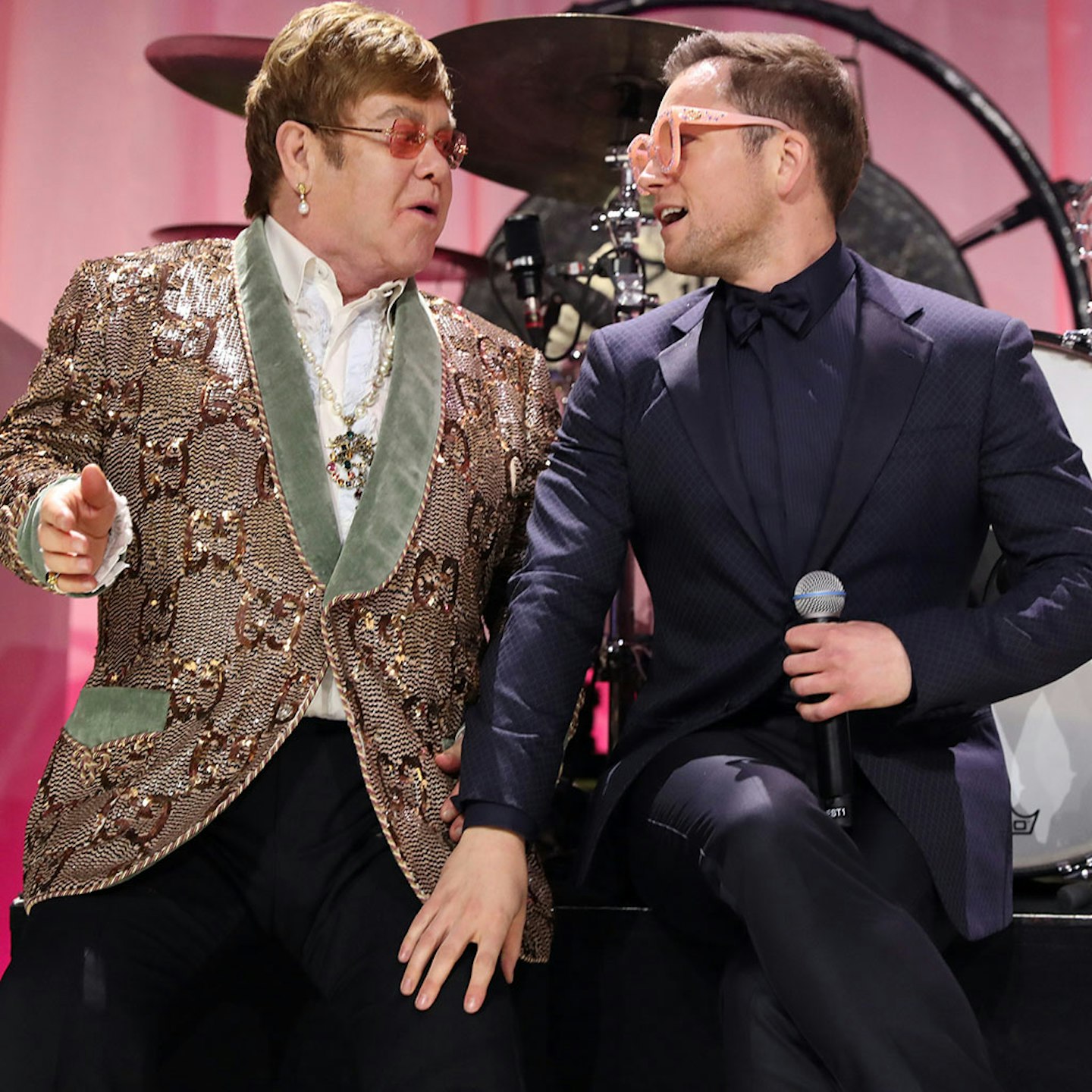 Elton and Taron performing together at Elton's Academy Awards party