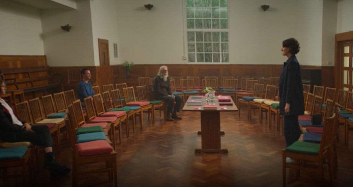 The Hot Priest laughing to himself after Fleabag gets up to say 'I sometimes worry I wouldn't be much of a feminist if I had bigger tits.'