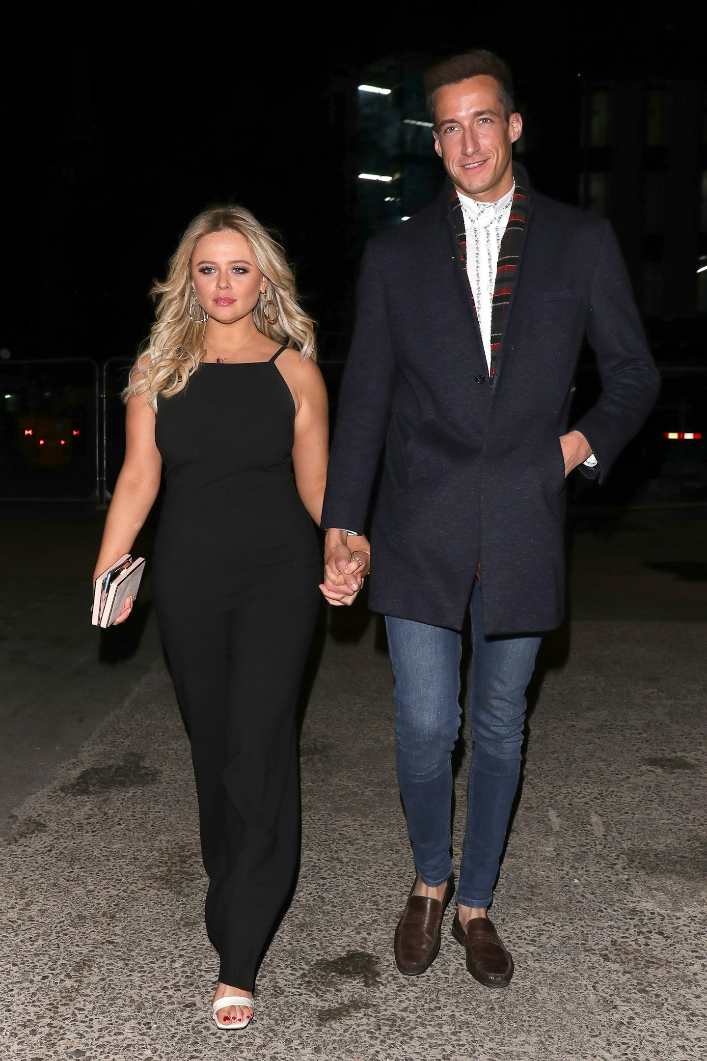 Emily Atack and Rob Jowers walking in the street
