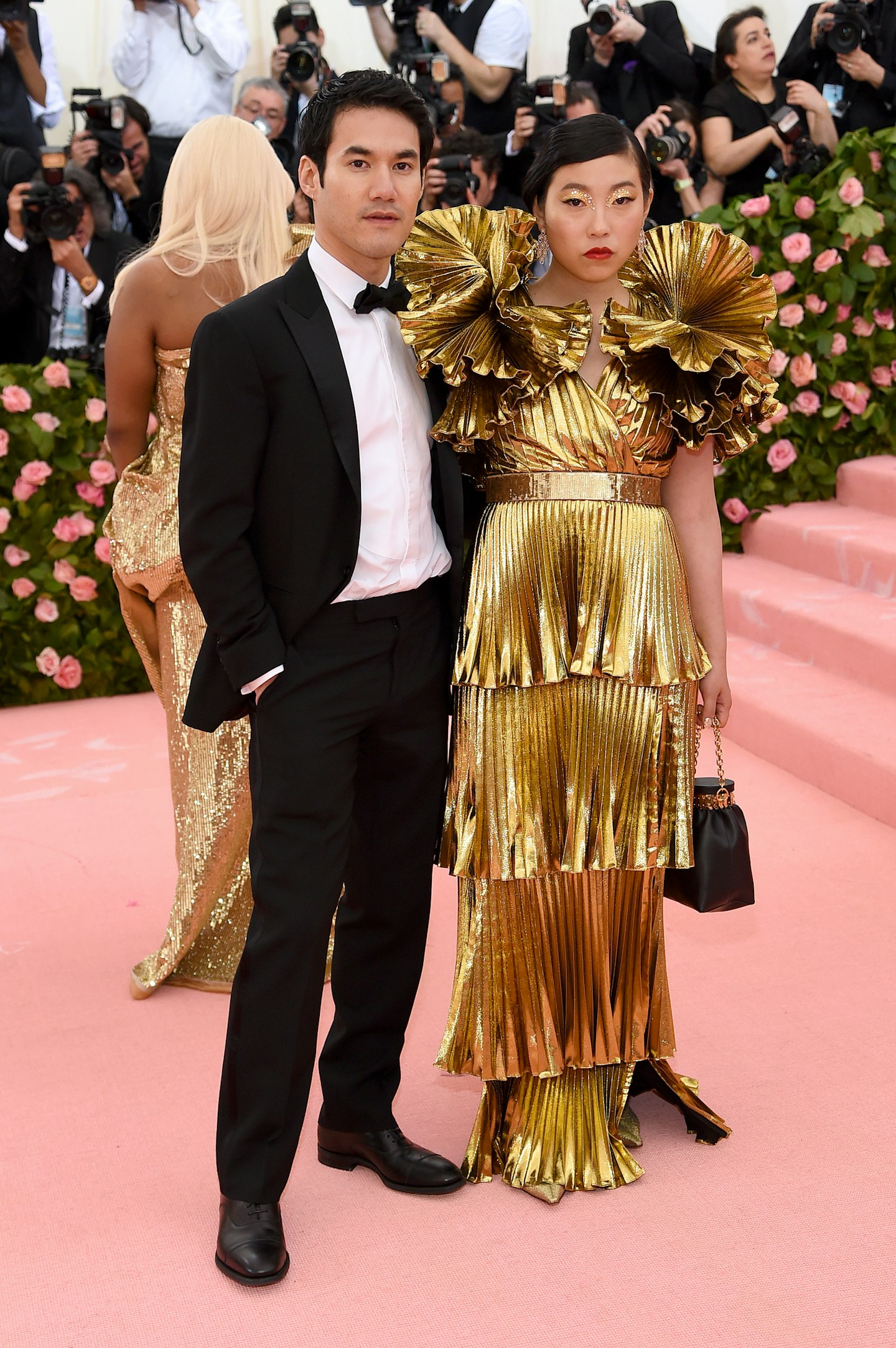 Designer Joseph Altuzarra was accompanied by Awkwafina, who wore a gold dress of his design