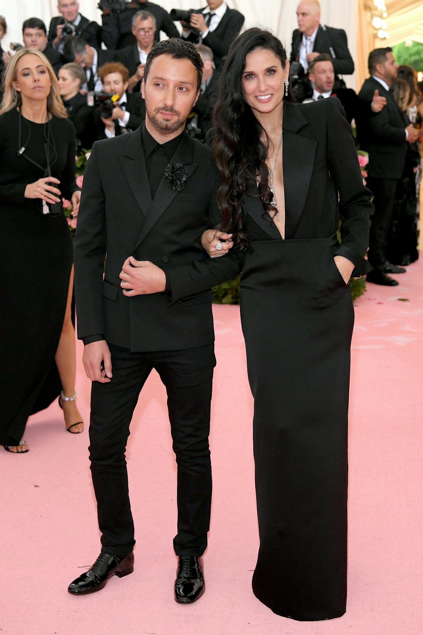 Demi Moore wore Saint Laurent and was accompanied by the brand's creative director, Anthony Vaccarello