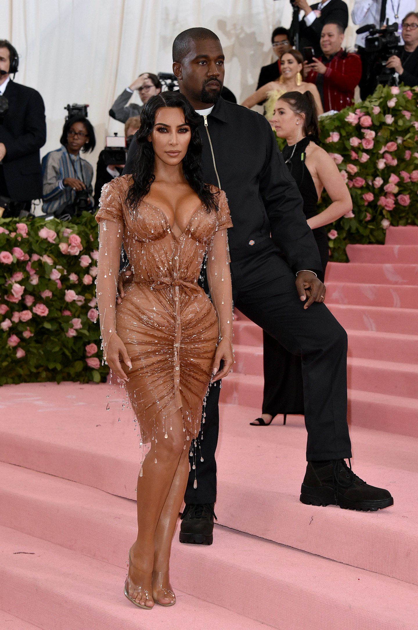Kim Kardashian-West, accompanied by husband Kanye, wore a dress designed by Mugler