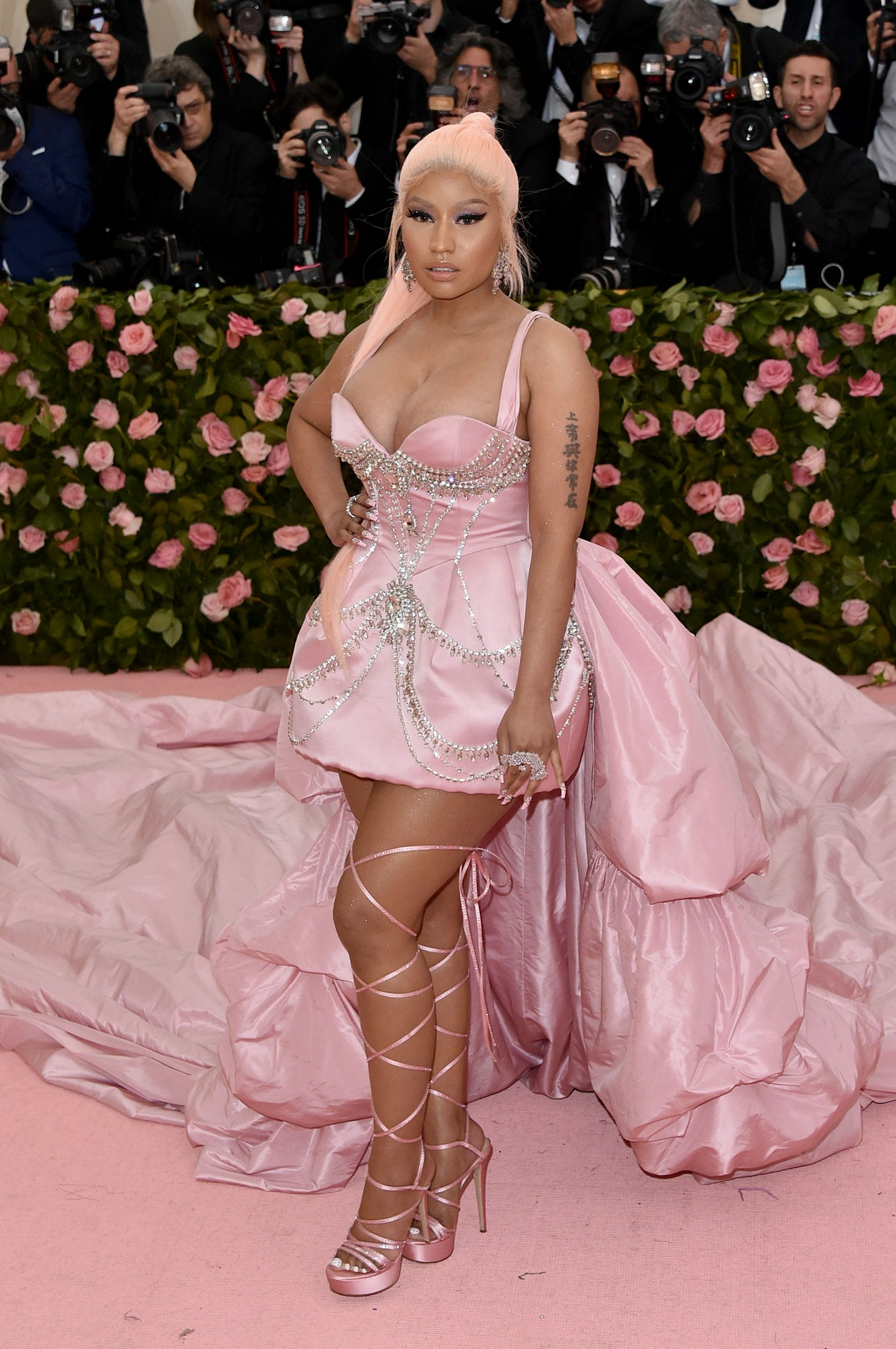 Nicky Minaj wore a pale pink gown with a dramatic train