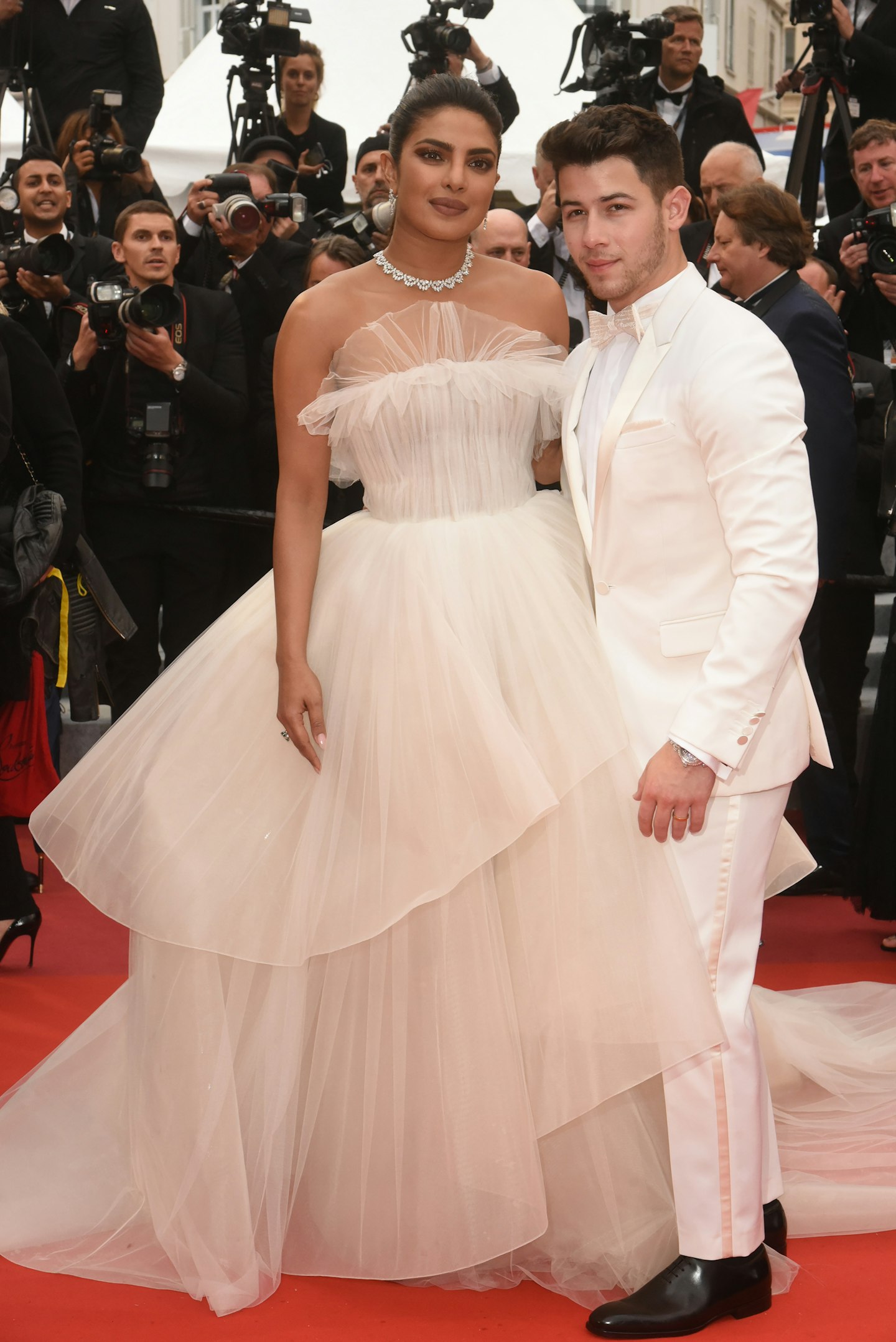 Priyanka Chopra, in Georges Hobeika Bridal and Nick Jonas in a white Berluti tuxedo