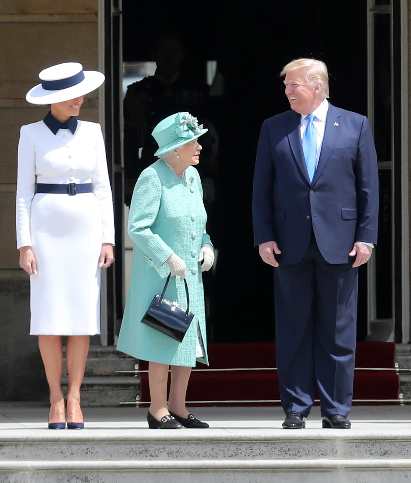 Melania Trump with the Queen and President Trump