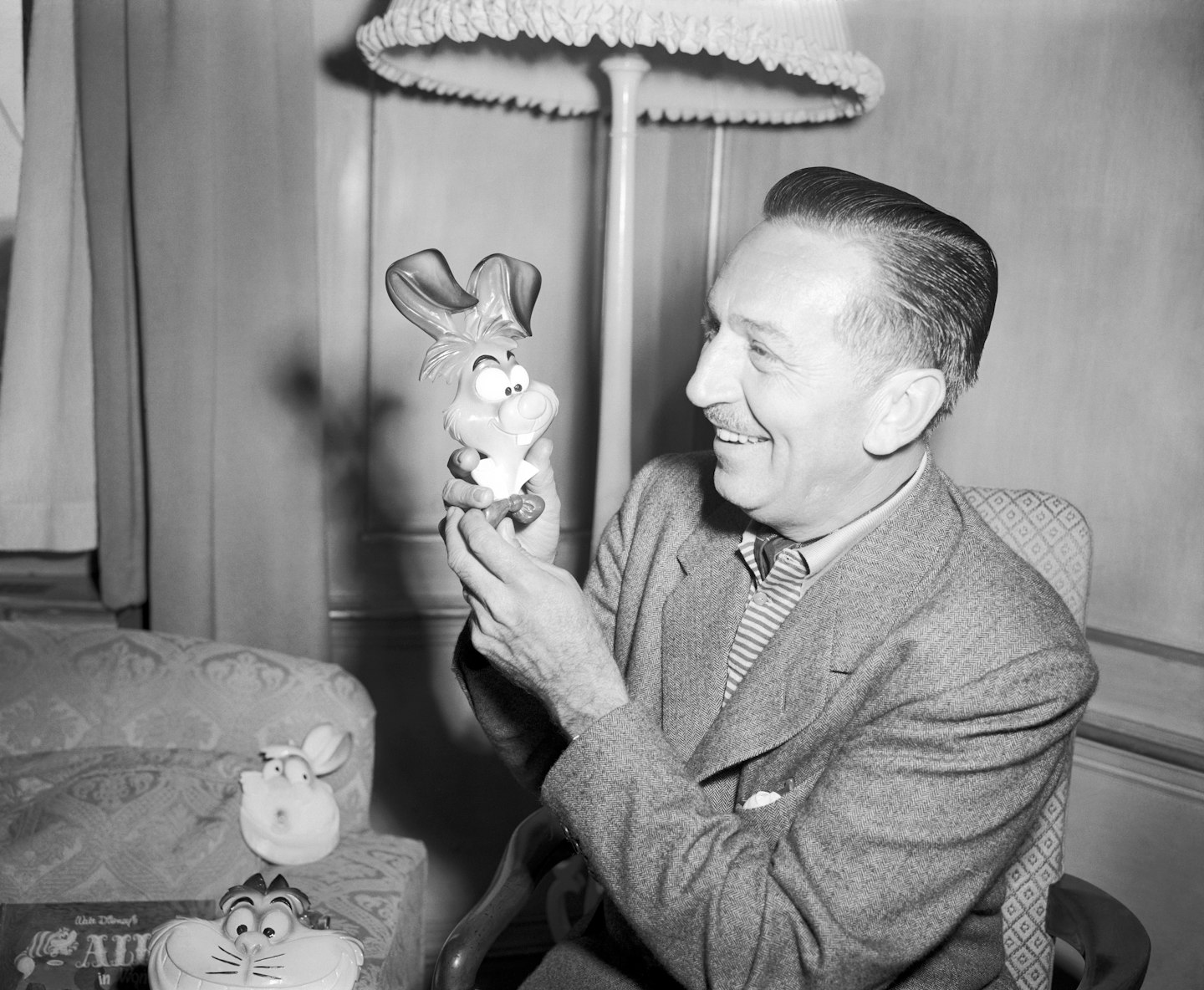 Walt Disney with one of his own creations, the 'March Hare', from his latest cartoon film 'Alice in Wonderland'.