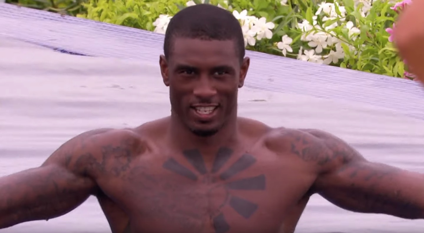 ovie from love island in the pool smiling