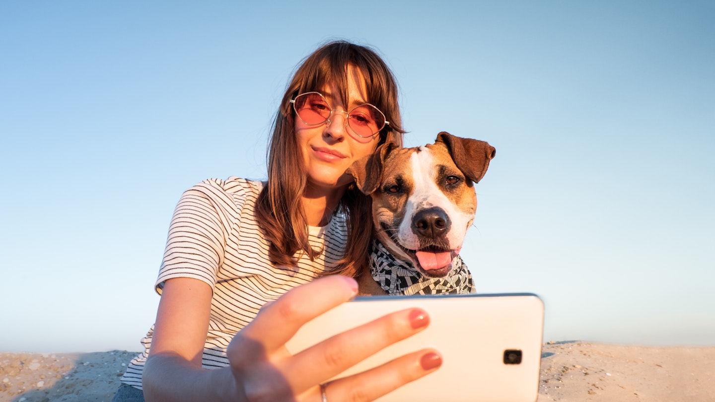 Woman and dog taking selfie
