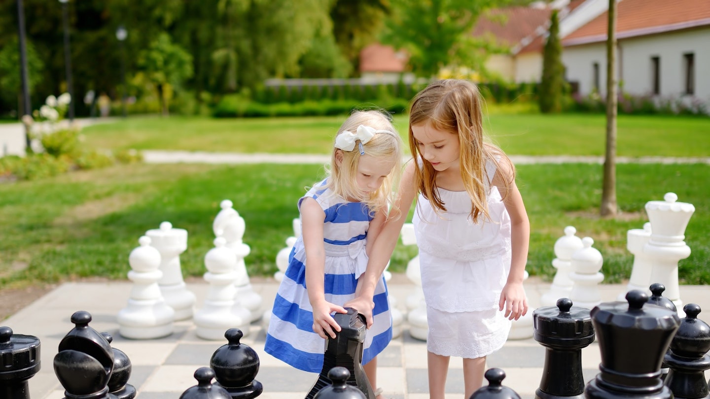 kids playing giant chess