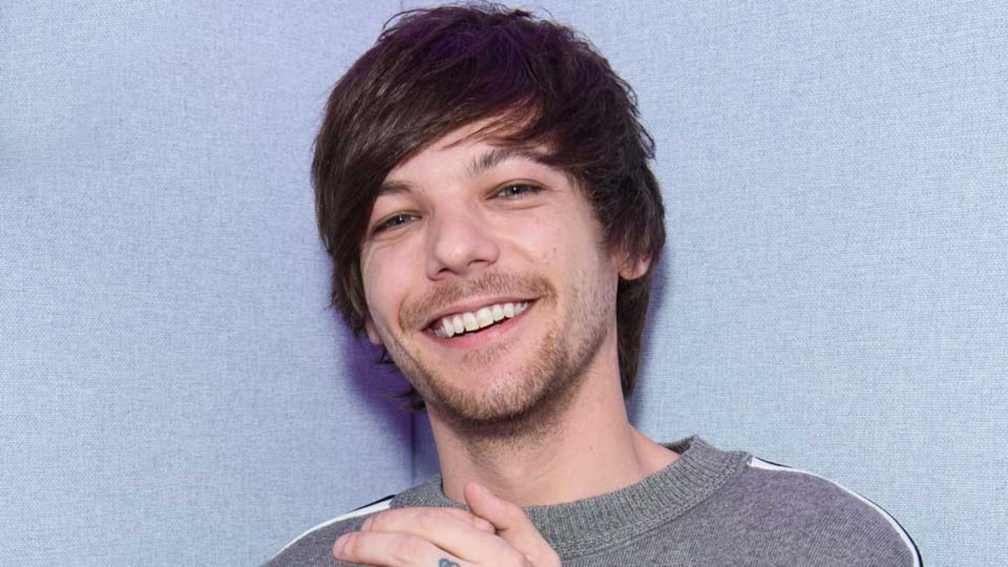 Louis Tomlinson dons a hoodie to visit Sony in London