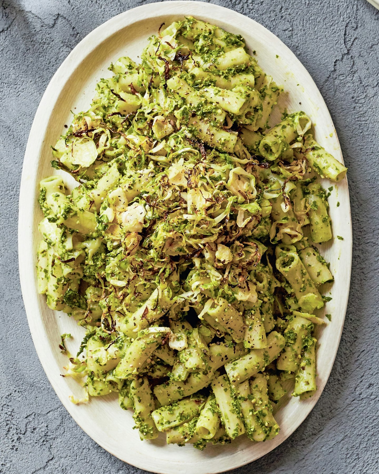 Spinach and kale pasta with crispy Brussels sprouts