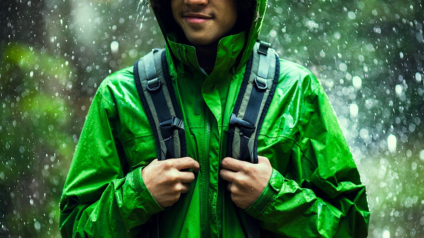 Man in rain, smiling because of waterproof choice