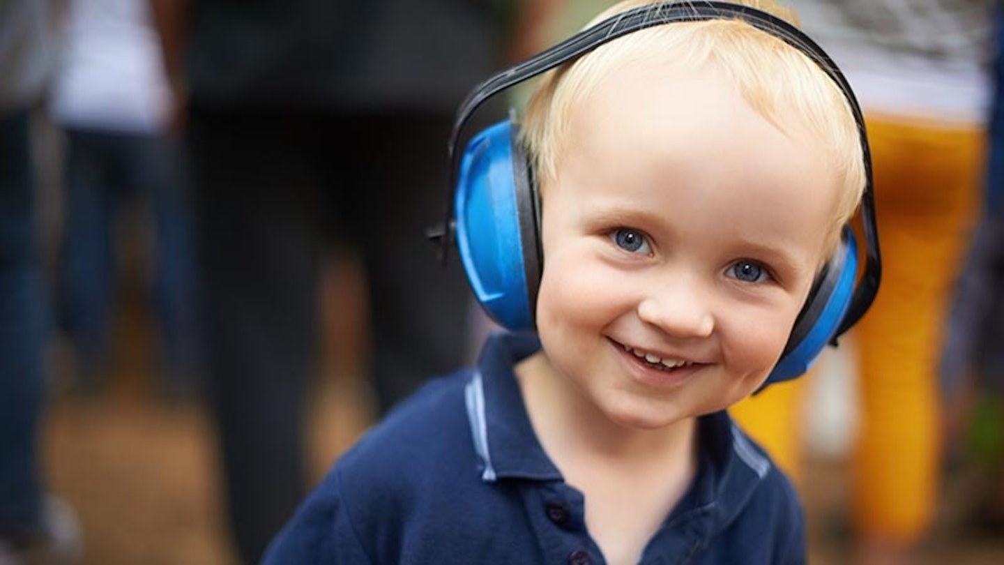 Toddler wearing ear defenders