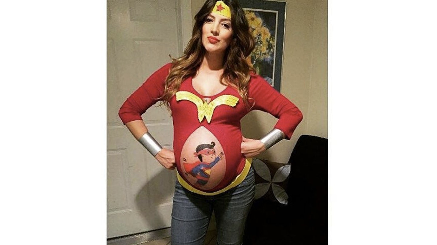super woman inspired baby bump painting