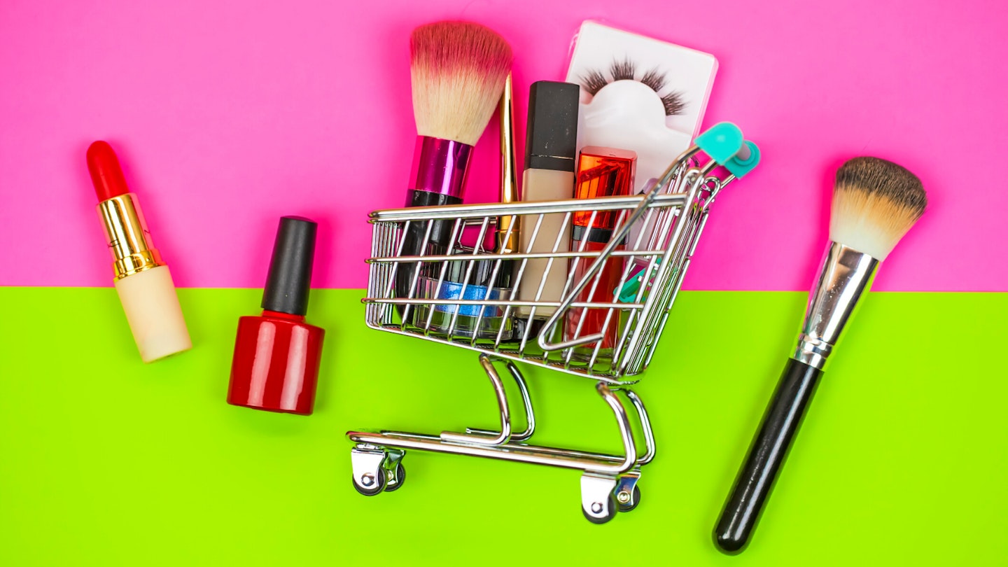 Makeup products in mini shopping trolley