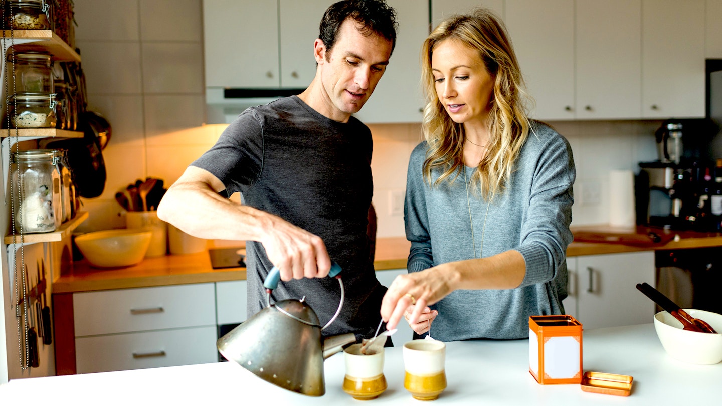 Alessi kettle being used by couple making tea