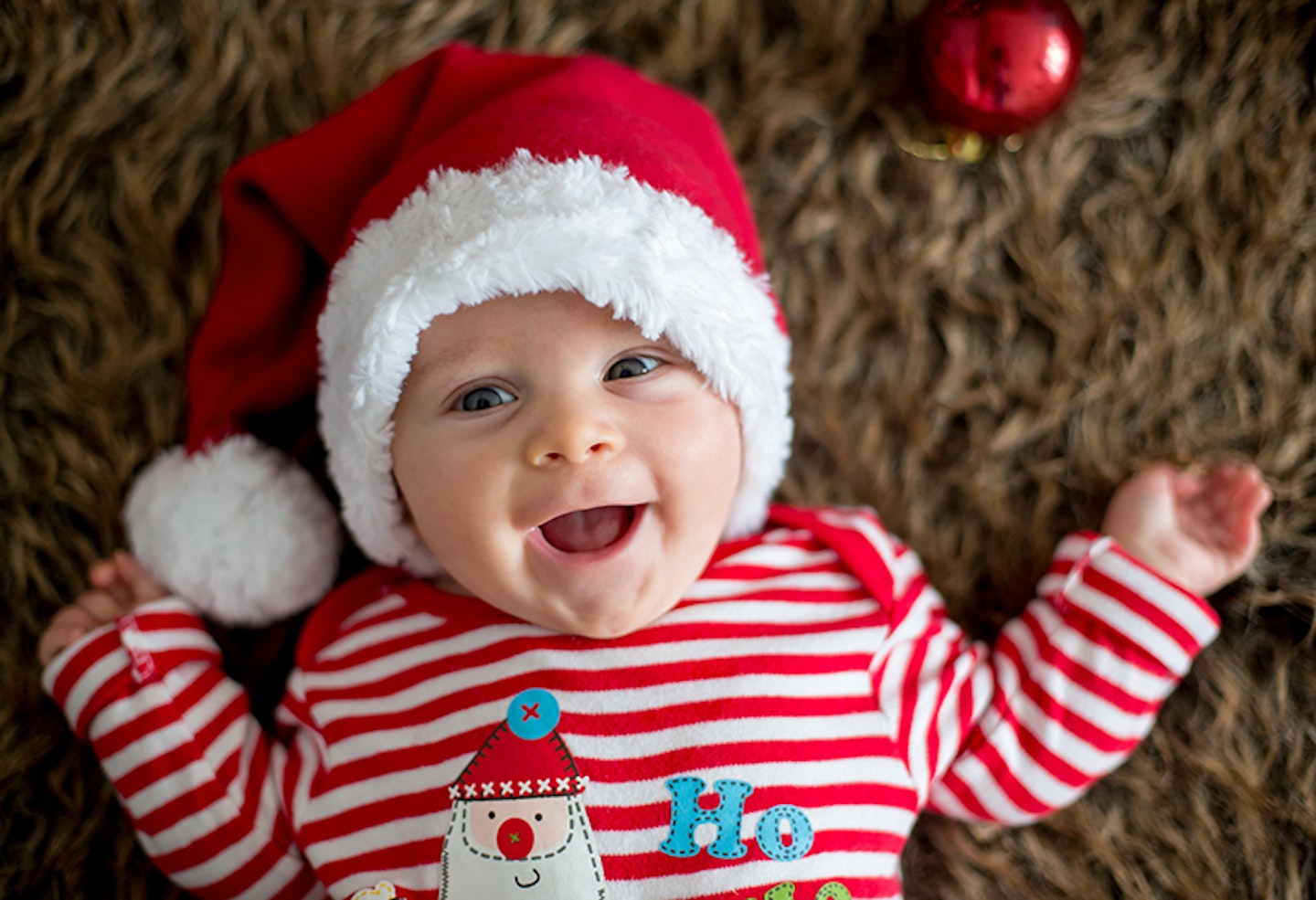 Baby wearing Christmas outfit