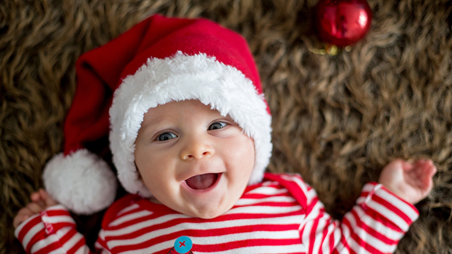Baby wearing Christmas outfit 