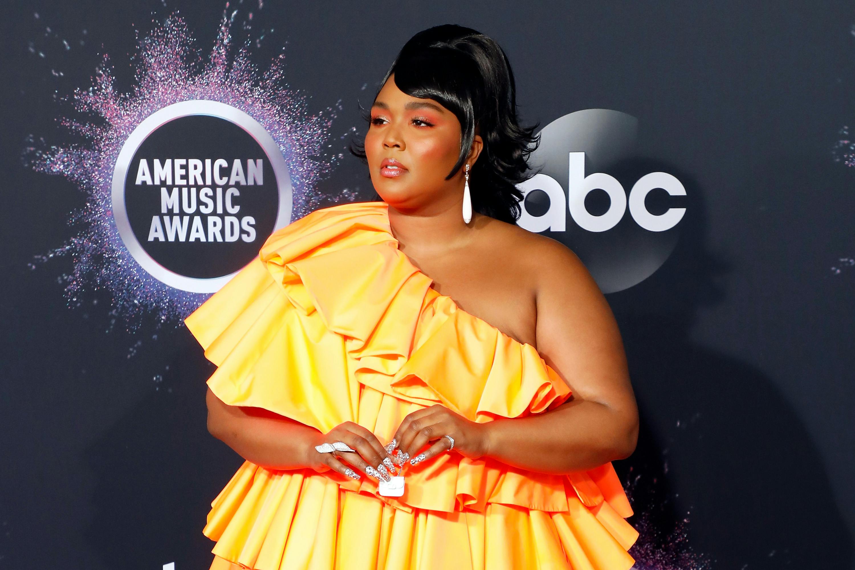 Just What Was Lizzo Holding In Her Teeny Tiny Valentino Microbag At The