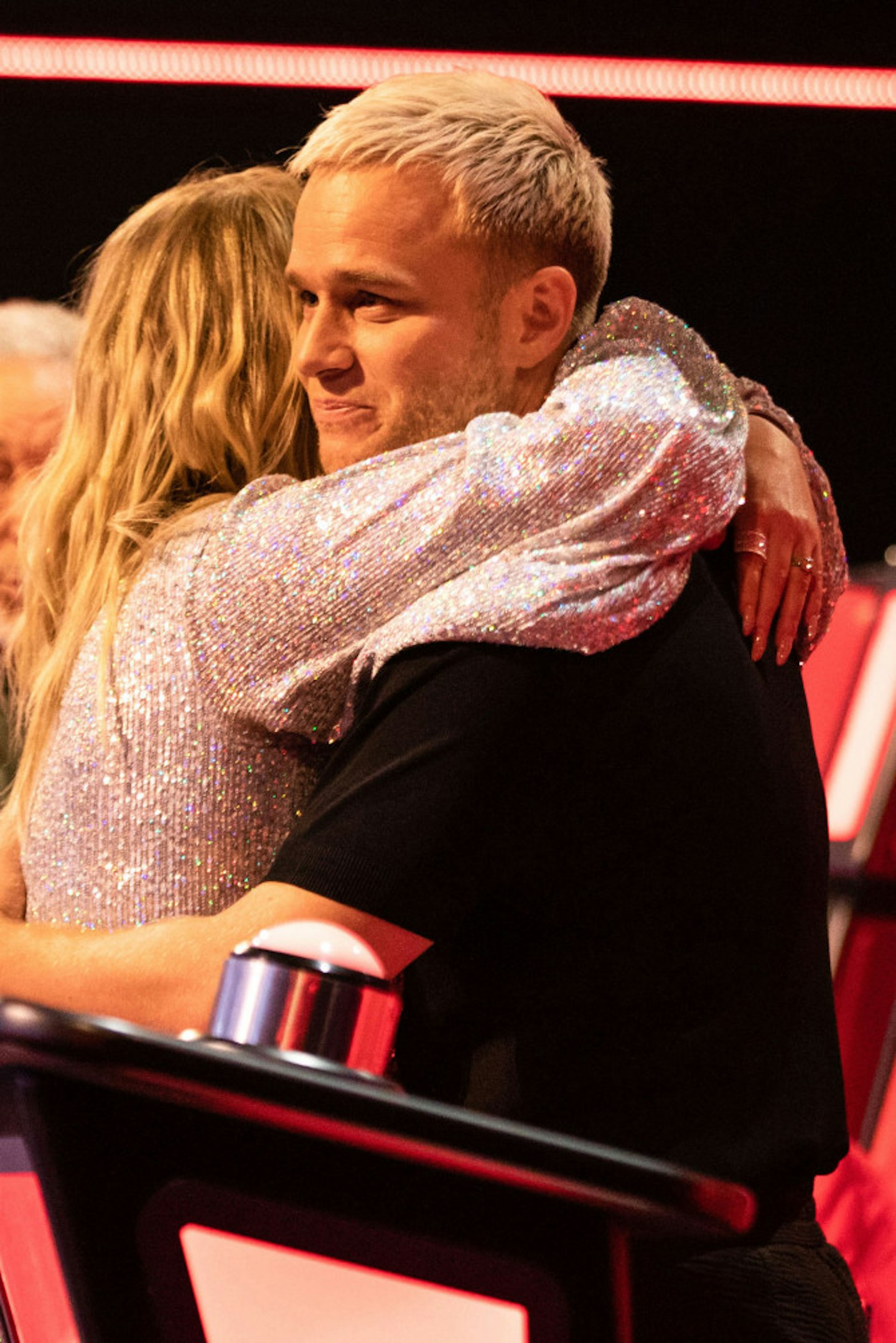 Meghan Trainor hugs Olly Murs after his admission