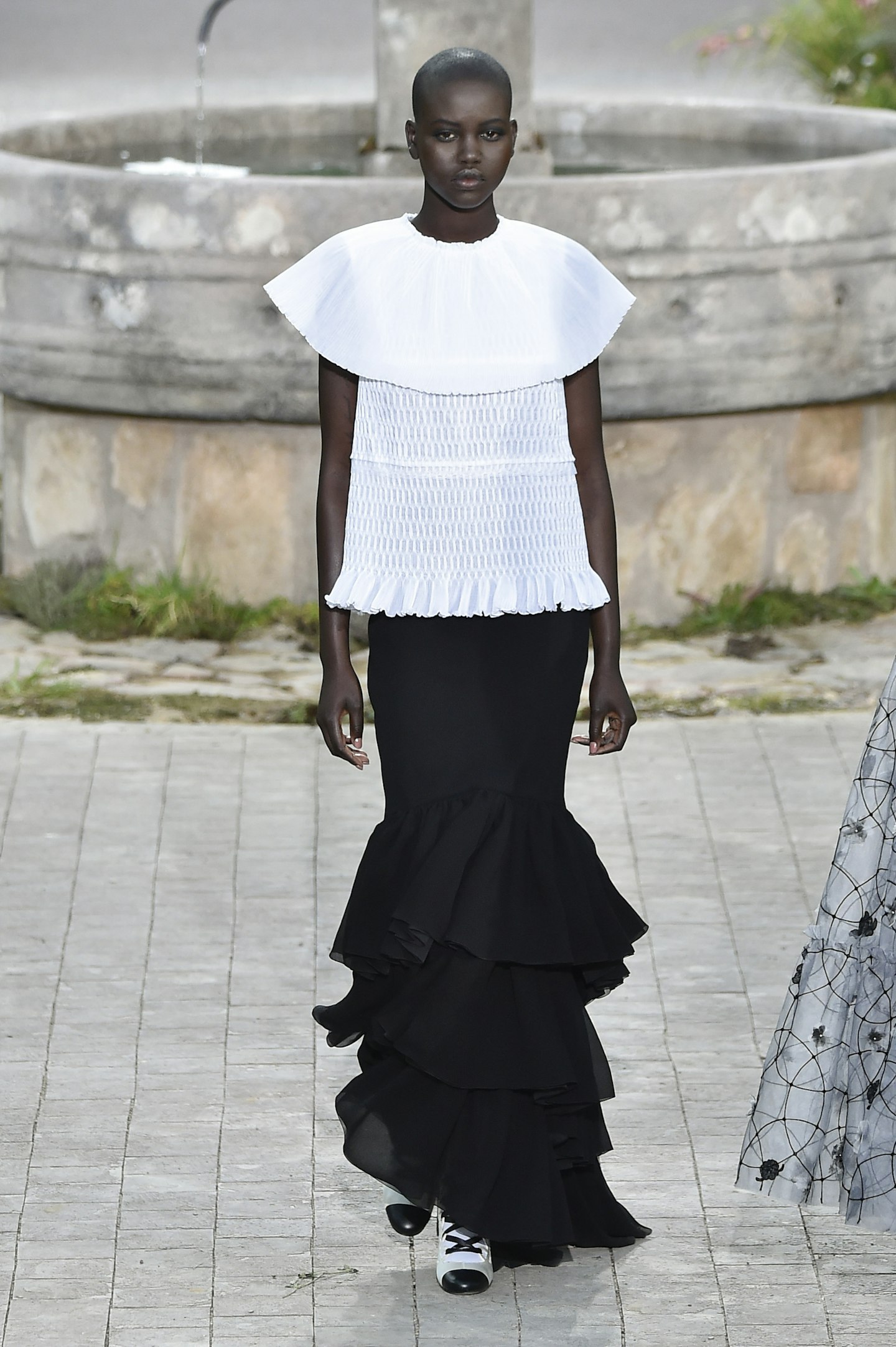 Adut Akech in her oversized Chanel collar 